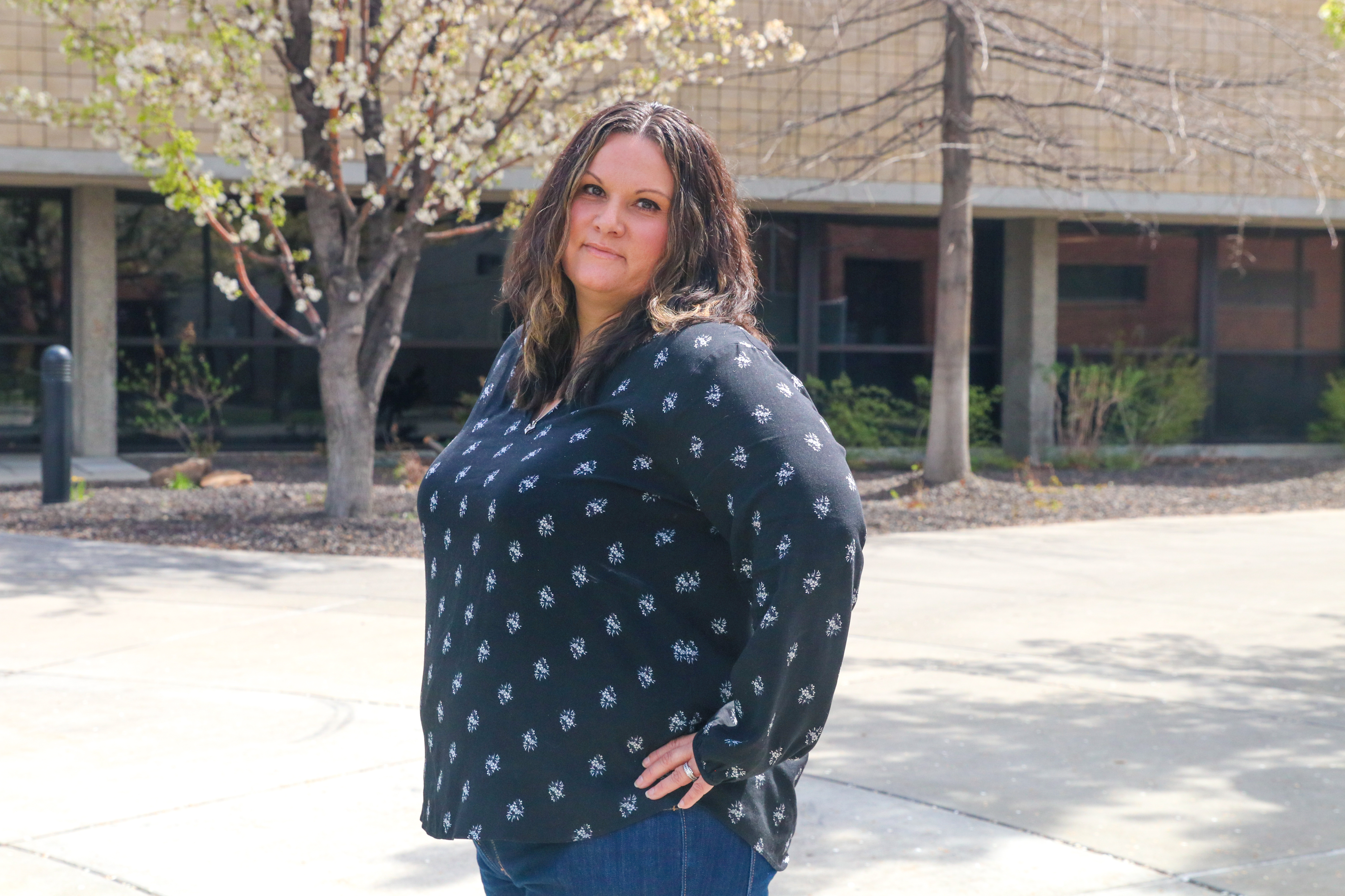 Michele Coville poses for photo on campus