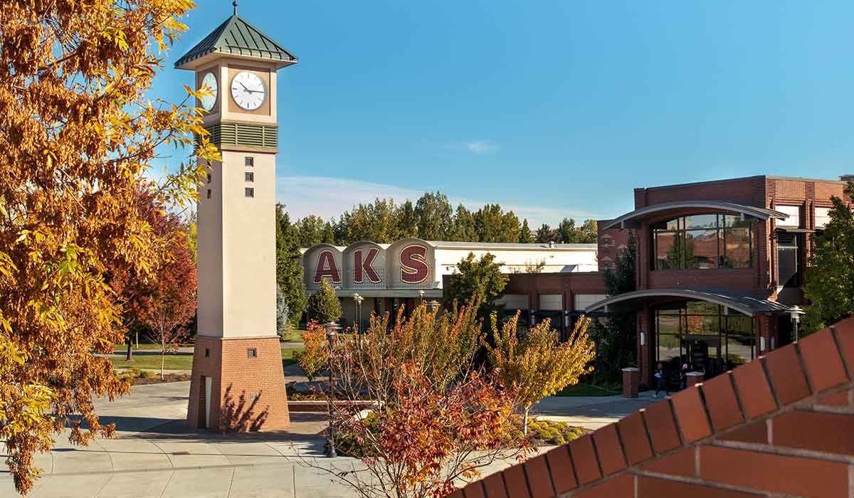 Clock tower with Sherar Gymnasium and Raymond Hall Library in the background 