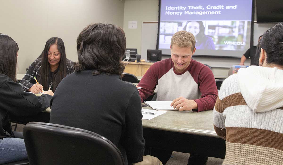 Students work on a group project in their class for the BASM program