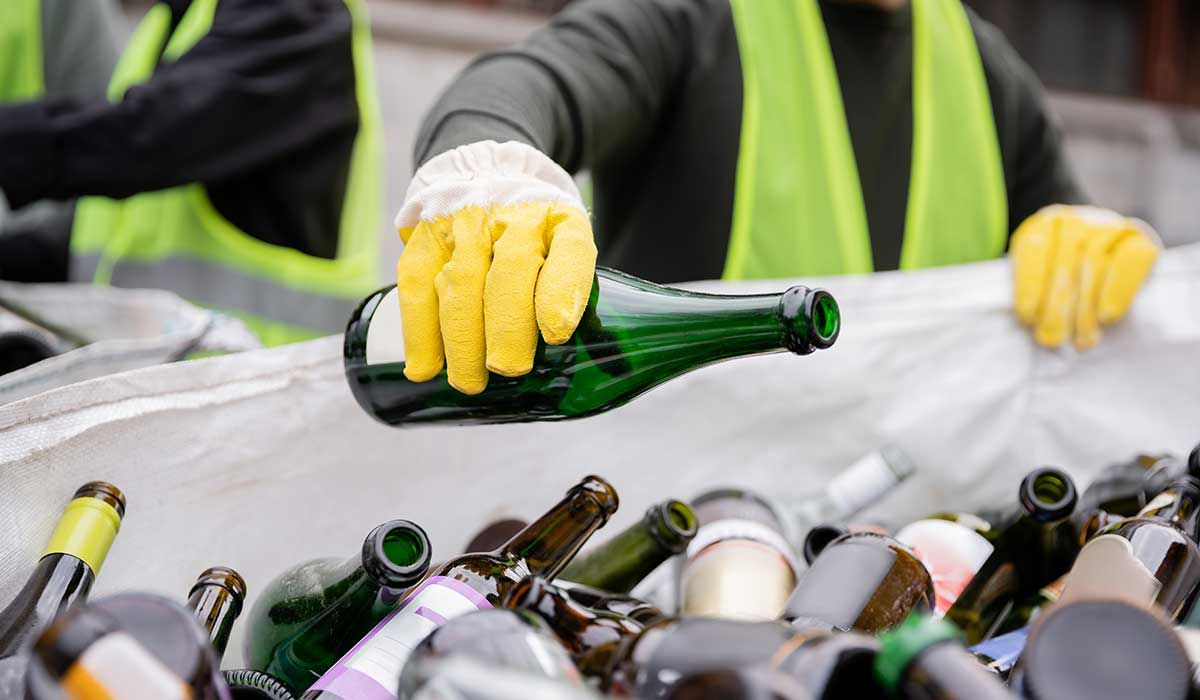 Close up view of a blurred worked recycling glass bottles