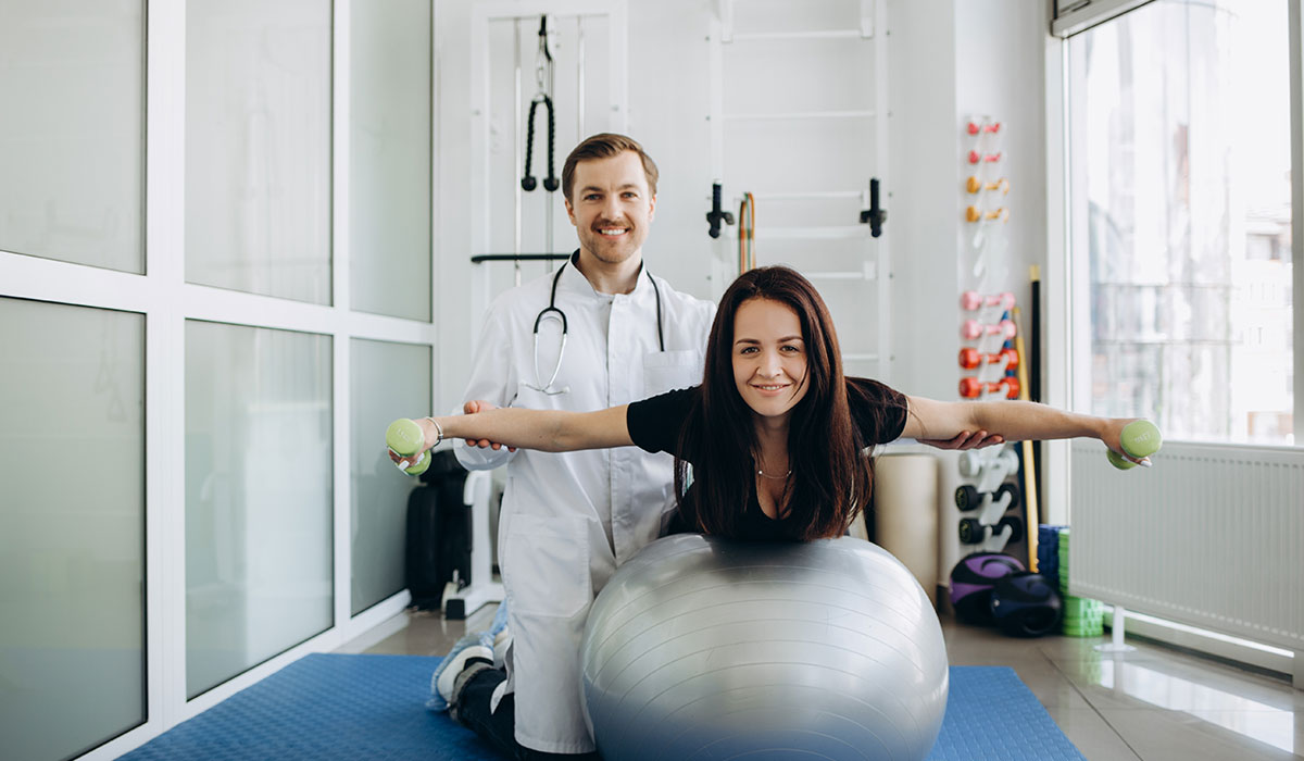 Physical therapist helps a patient