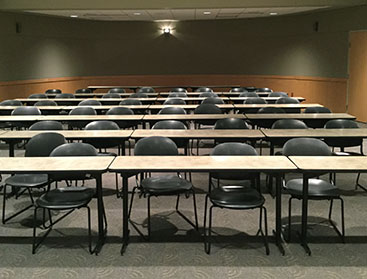 Picture of an empty room in a YVC large meeting room.