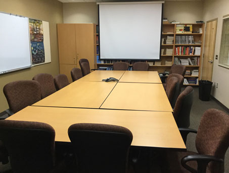 Picture of an empty small conference room. 