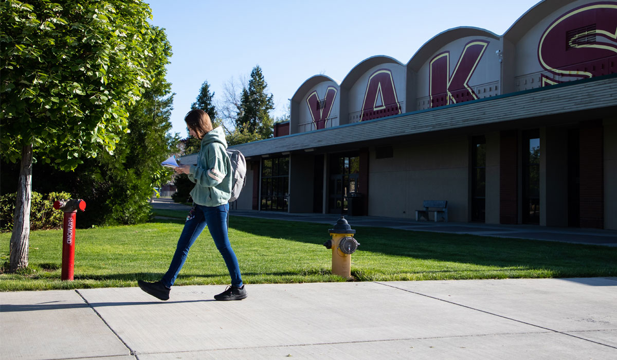 Student walks through the YVC campus. 