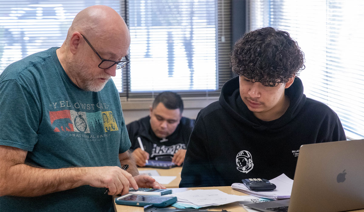 Student recieves one-on-one attention on assignment. 