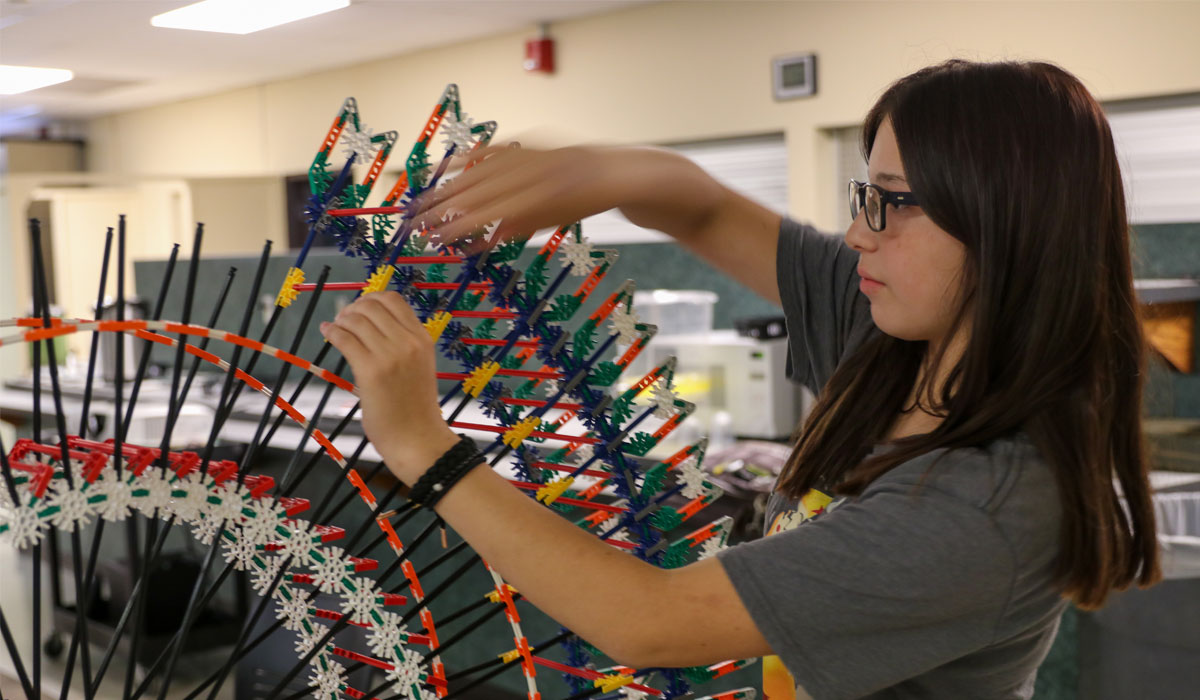 student working on building project. 