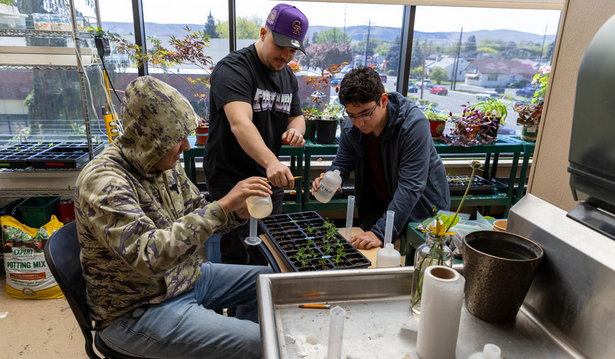 Students planting during agriculture class.