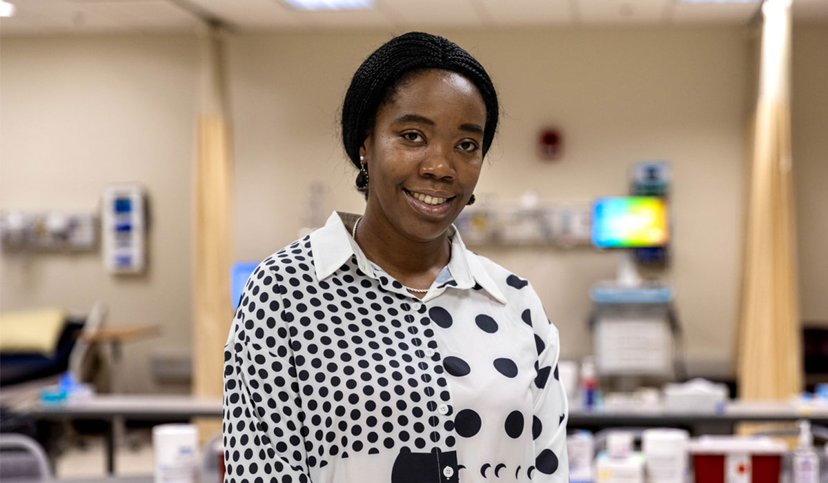 Onyinye Onyeoma poses for student story picture in a YVC classroom. 