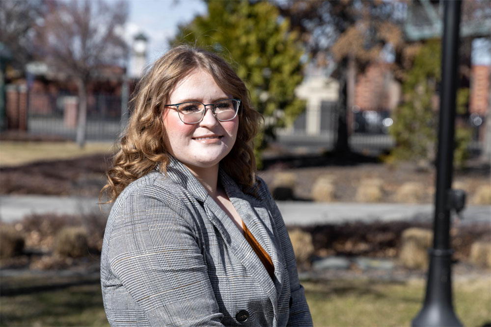 Abigial Johnson poses for Student Story picture outside on the YVC Campus.