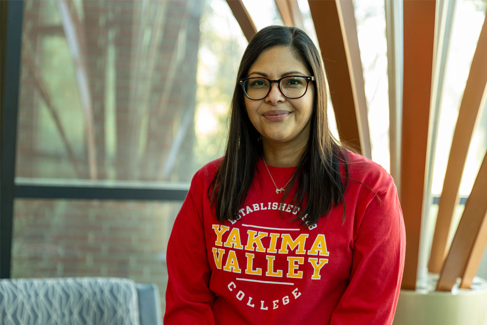 Carmela Olivera poses in her YVC shirt for her Student Story picture. 