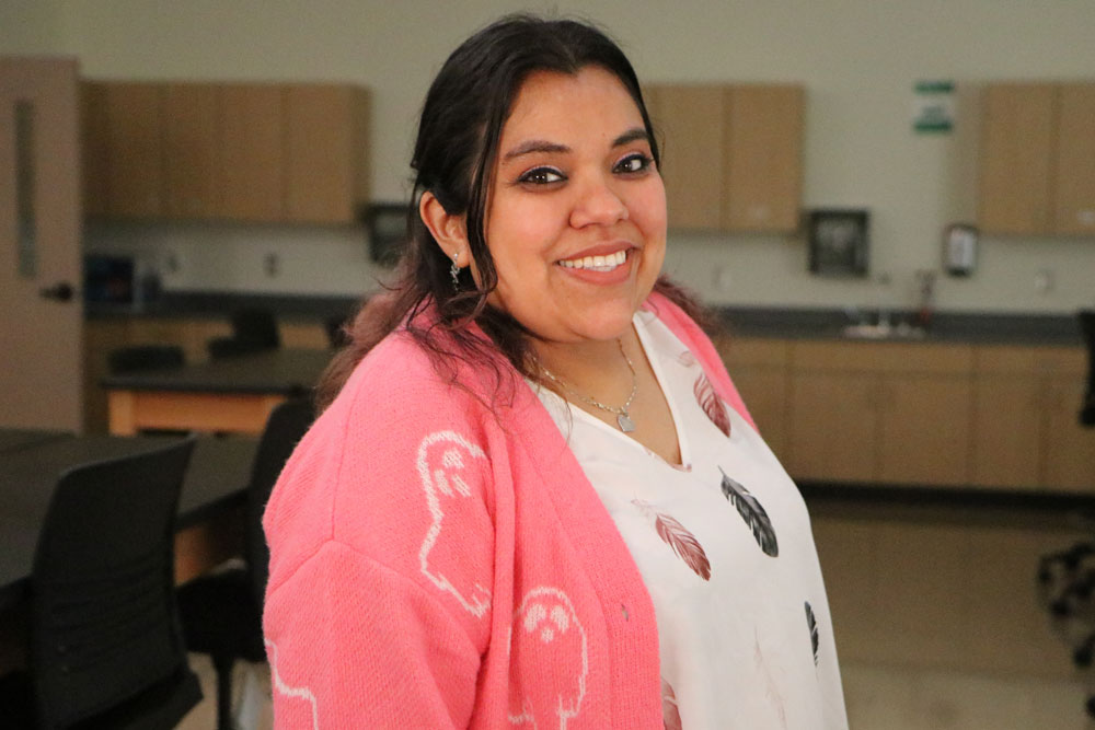 Esmerelda Cruz poses for Student Story picture in a YVC classroom. 