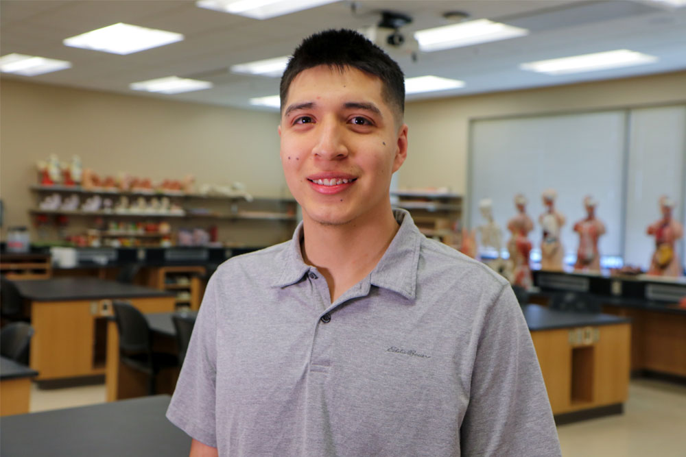 Francisco Flores-Martinez poses for Student Story picture in a YVC classroom. 