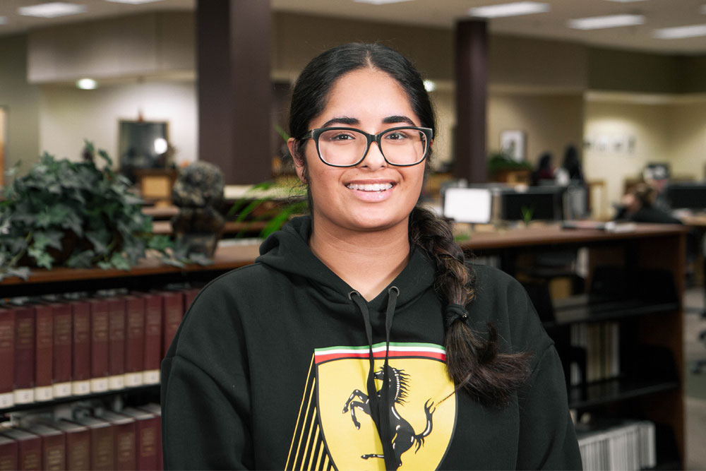 Jasmeen Chauhan poses for Student Story picture in a YVC administrative office. 