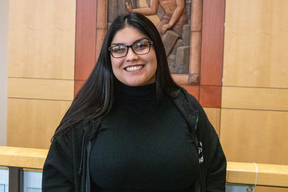 Maria Ruelas poses for Student Story picture inside YVC academic building. 