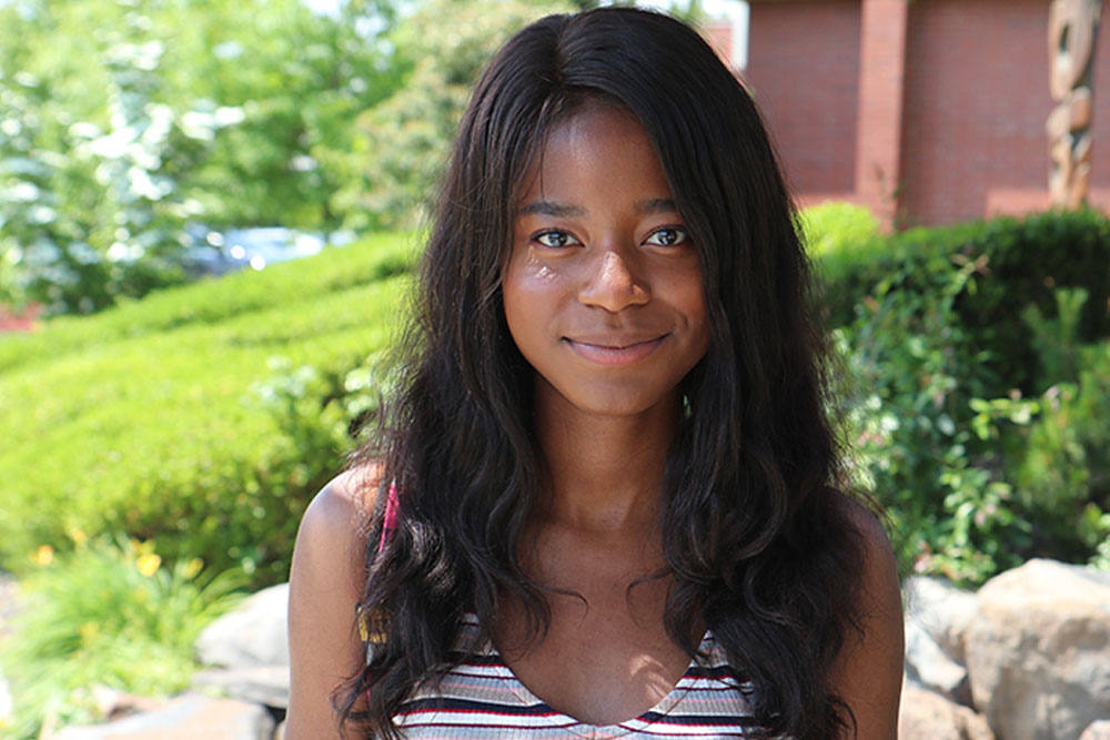 Mukobe Lukwesa poses for picture outside on the YVC campus. 