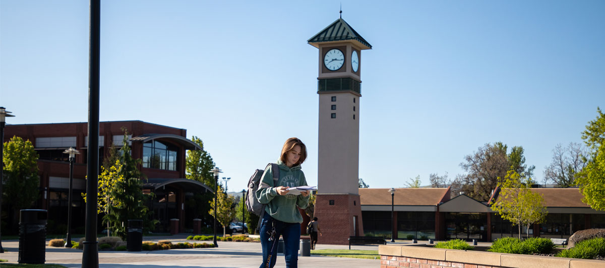 YVC student walks on YVC Yakima campus.