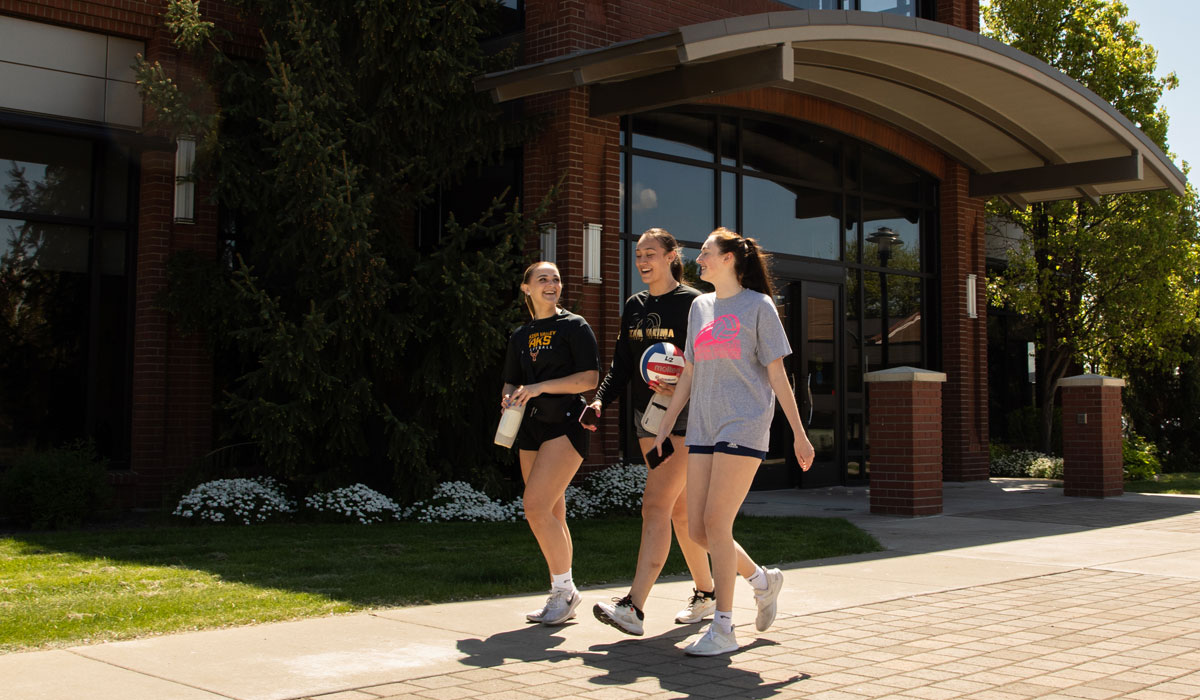 Three students walking to class on the YVC Campus