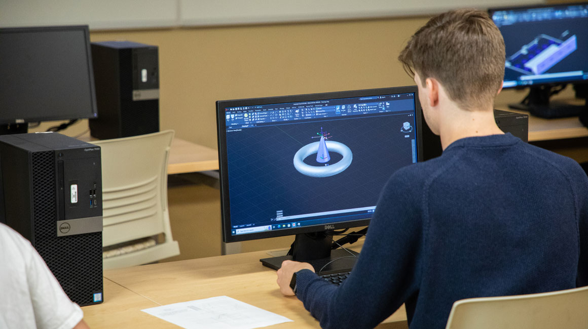 Student works on an assignment on the computer.