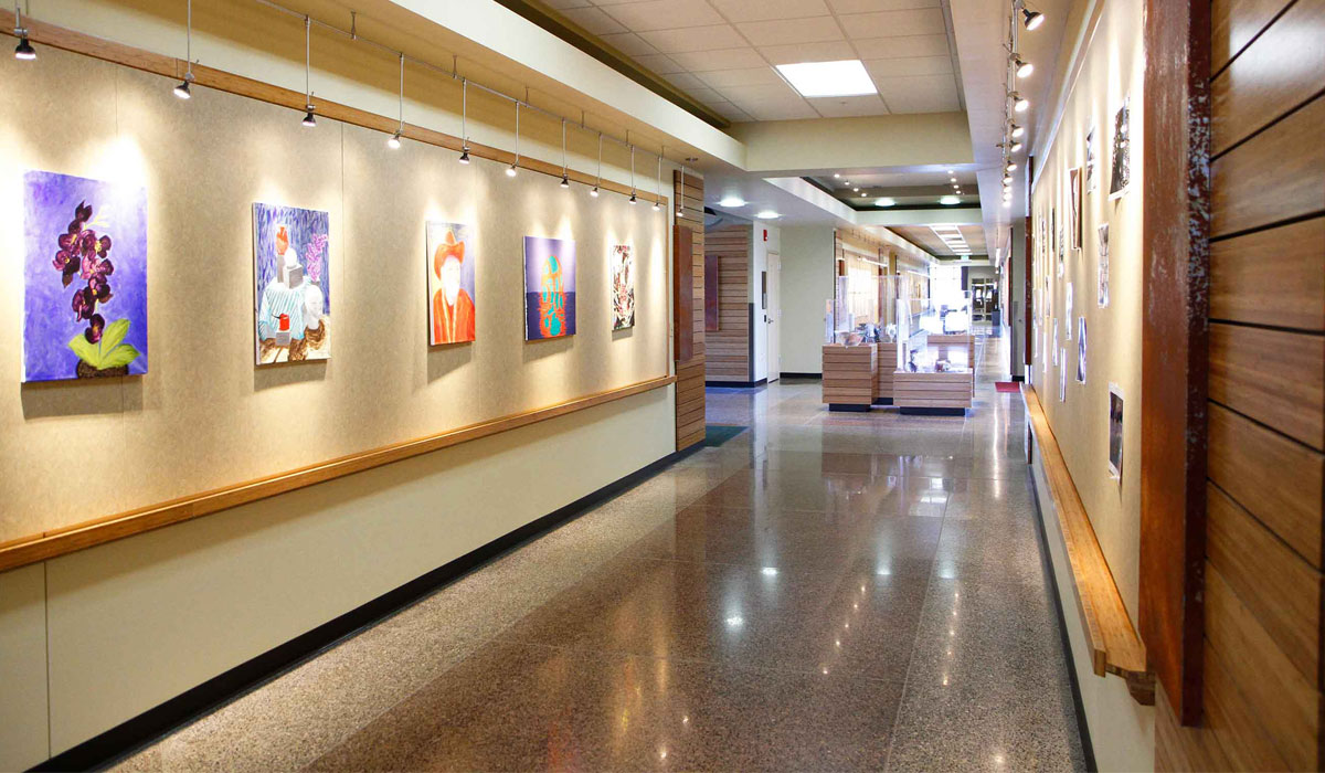 Image of the halls of Palmer Martin Hall Palmer Martin Hall featuring all-natural flooring, dual-duct heating and cooling with heat recovery in exhaust ports, and solar paneling on the roof.