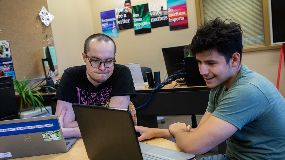 Students work on their computers during class.