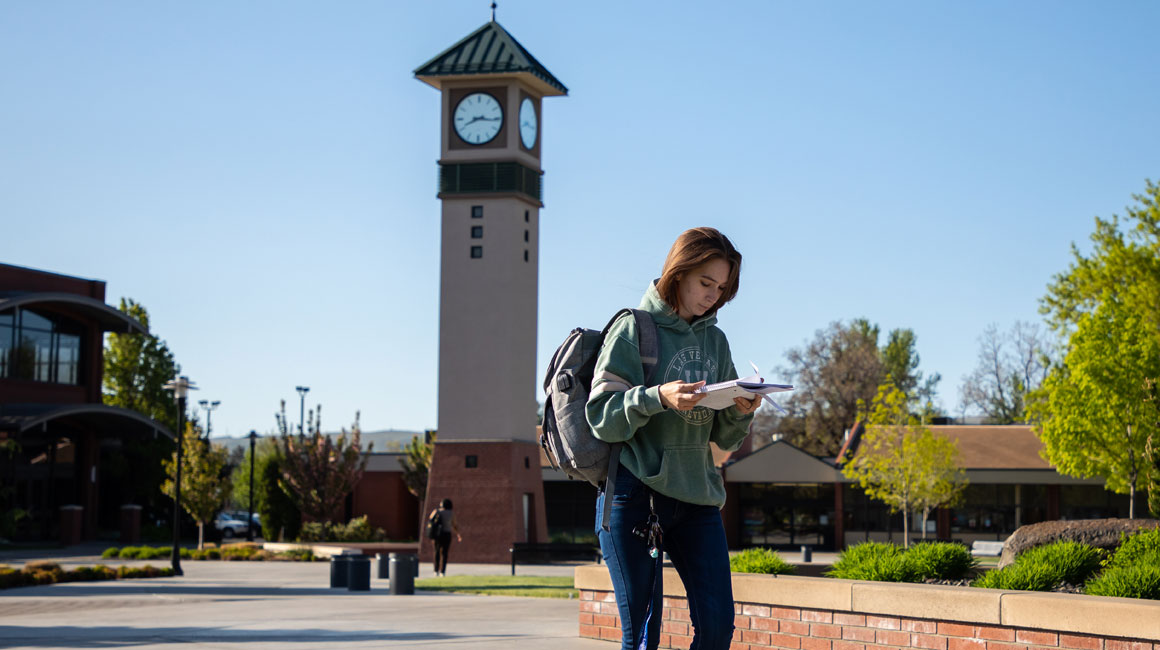 Student walks across the Yakima Campus.